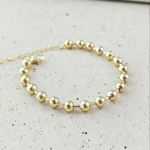 Bransoletka na rękę stal chirurgiczna pozłacana 14k złotem, kuleczki 6mm BST1762